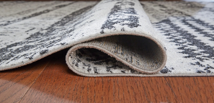 Devman 5'2" x 6'10" Rug - Furniture Story