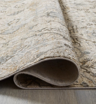 Dudmae 7'10" x 10'3" Rug - Furniture Story