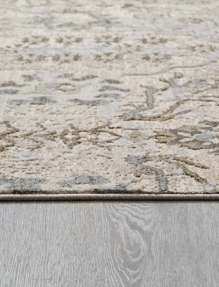 Dudmae 7'10" x 10'3" Rug - Furniture Story