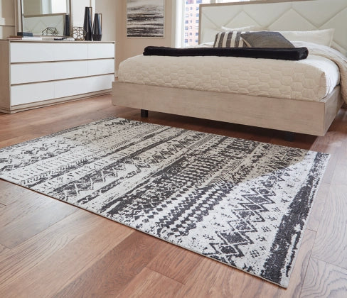 Devman 5'2" x 6'10" Rug - Furniture Story