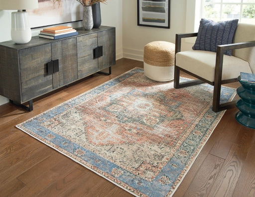 Hartton 5'2" x 7'1" Rug - Furniture Story