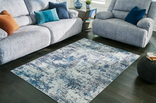 Putmins 7'10" x 10' Rug - Furniture Story