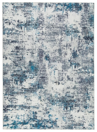 Putmins 7'10" x 10' Rug - Furniture Story