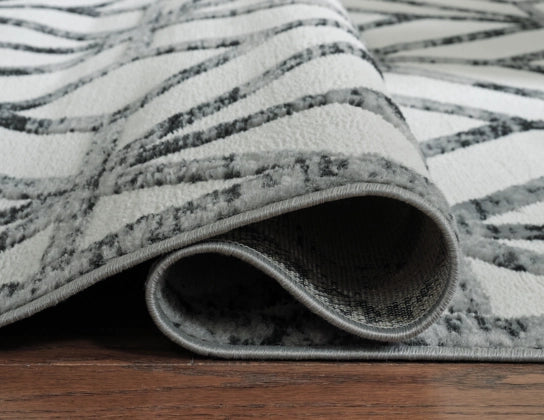 Reidland 7'10" x 9'10" Rug - Furniture Story