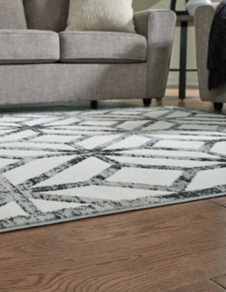 Reidland 7'10" x 9'10" Rug - Furniture Story