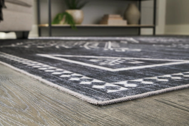 Arloman 7'5" x 9'6" Rug - Furniture Story