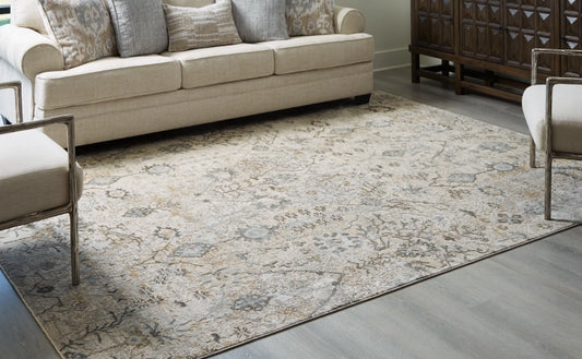 Dudmae 7'10" x 10'3" Rug - Furniture Story