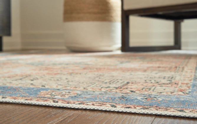 Hartton 5'2" x 7'1" Rug - Furniture Story