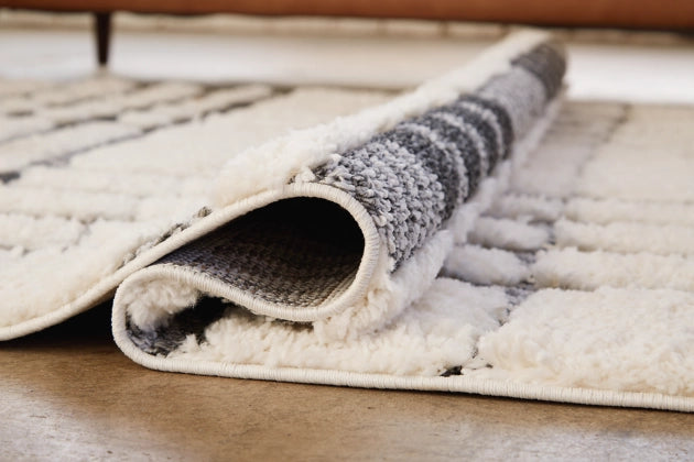 Oladon 5'3" x 7'3" Rug - Furniture Story