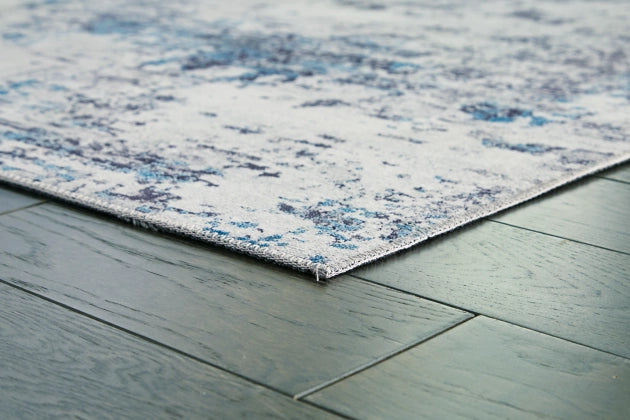 Putmins 7'10" x 10' Rug - Furniture Story