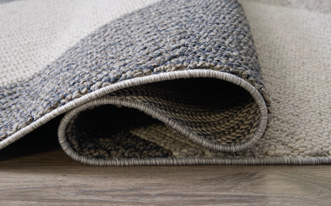 Toksook 7'10" x 10'6" Rug - Furniture Story
