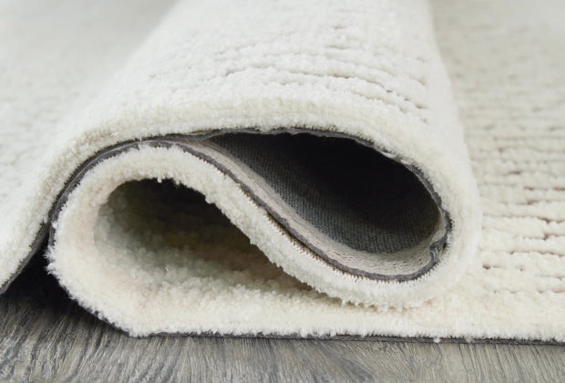 Vallcherr 7'8" x 10' Rug - Furniture Story