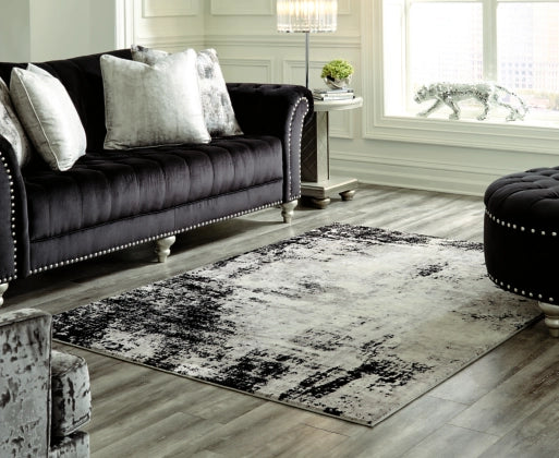 Zekeman 7'10" x 10' Rug - Furniture Story