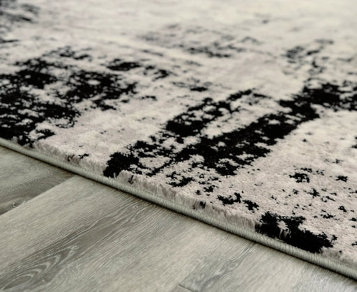 Zekeman 7'10" x 10' Rug - Furniture Story