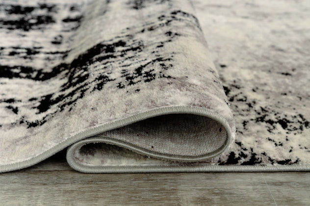 Zekeman 7'10" x 10' Rug - Furniture Story